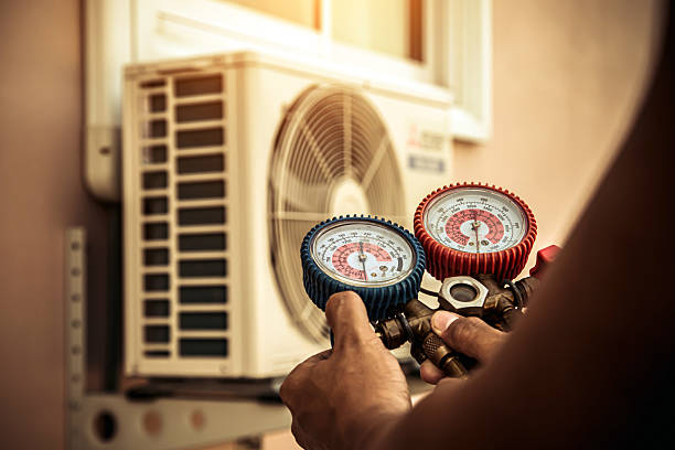 Professional Air Conditioning Service technician working in Columbus, NC